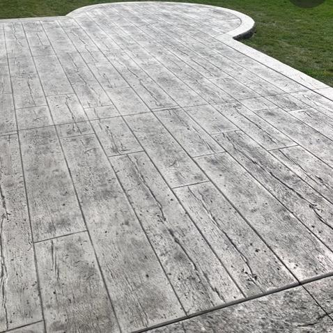 Large stamped concrete patio by Majerus Outdoor Services