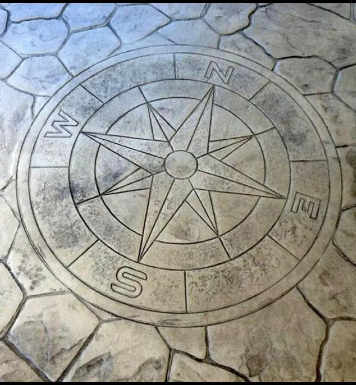 Decorative compass concrete design by Majerus Outdoor Services