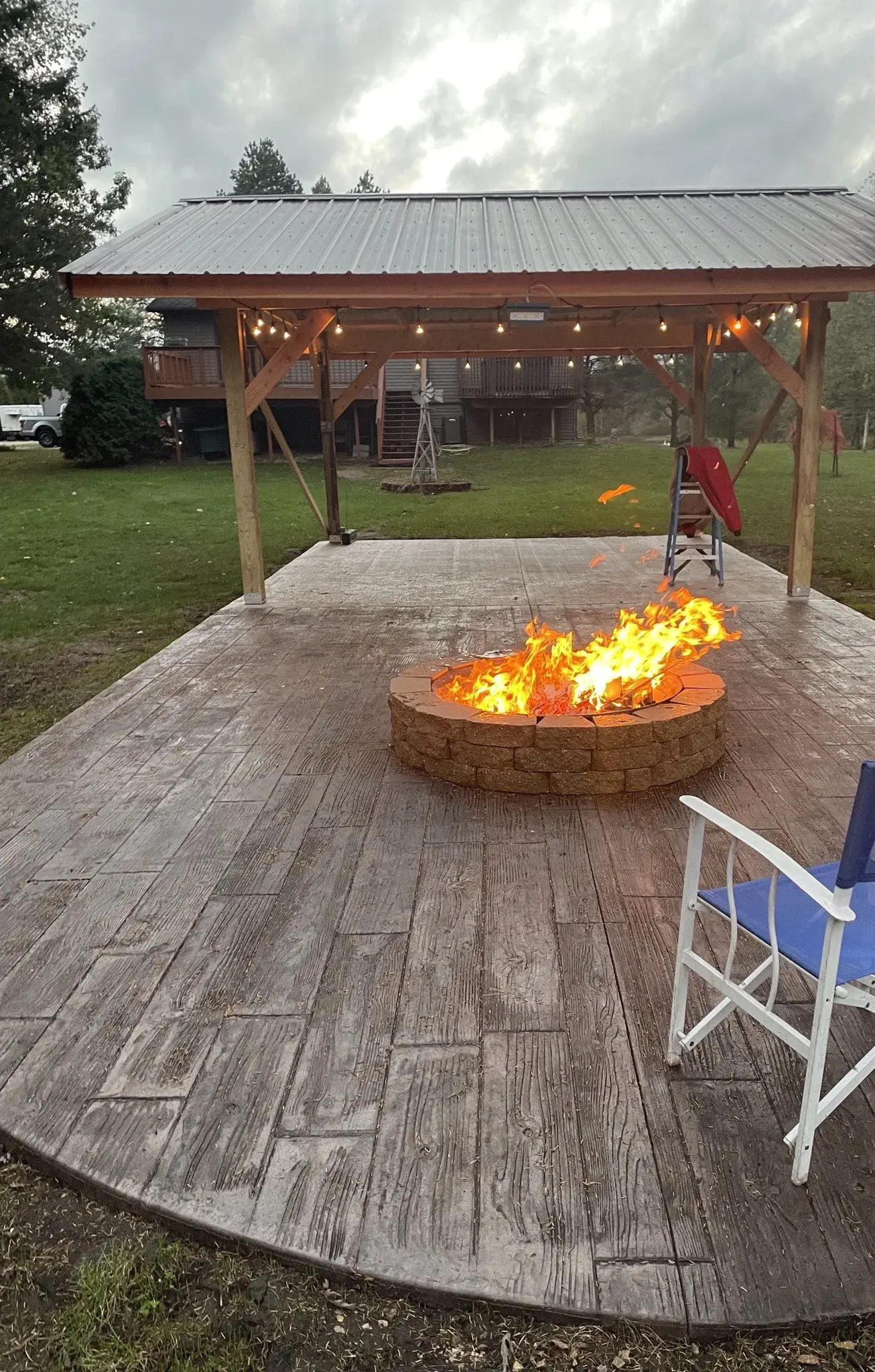 Stamped concrete patio and fire pit by Majerus Outdoor Services