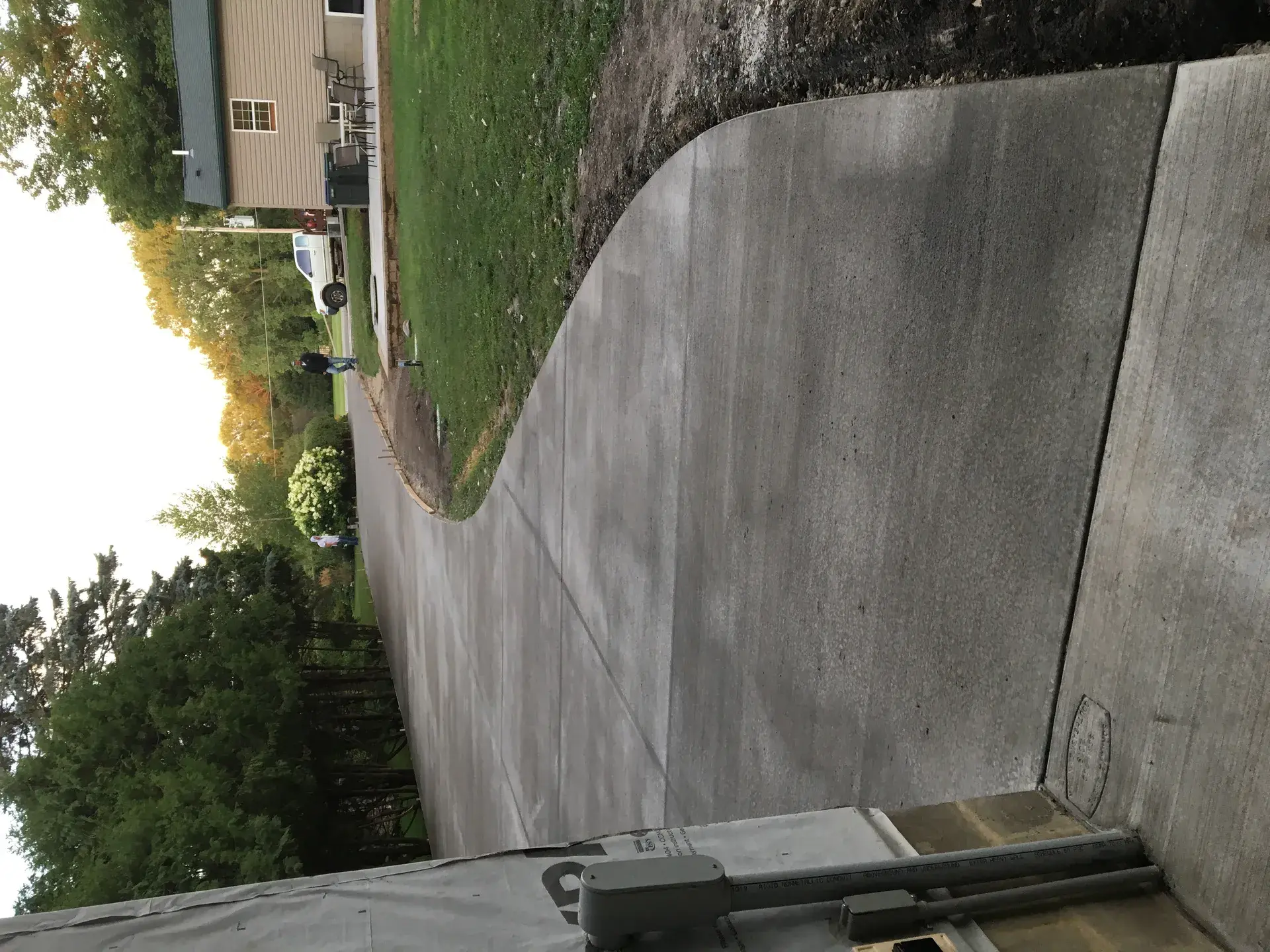 Residential concrete driveway by Majerus Outdoor Services