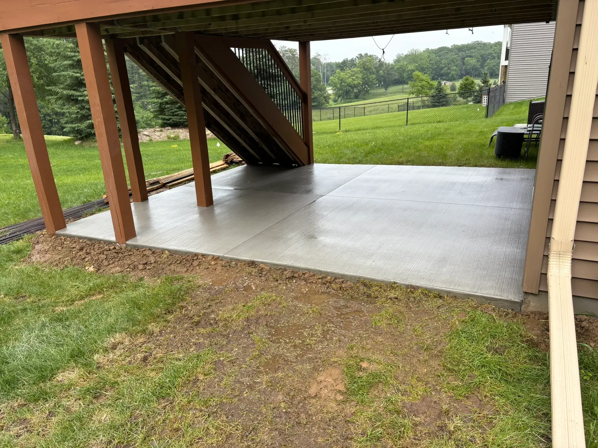 Finished under-deck concrete slab by Majerus Outdoor Services